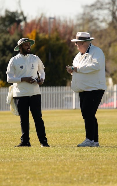 MCUA umpires sharing a conversation between play